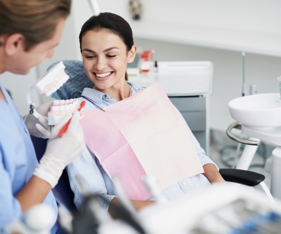 Woman with healthy smile after gum disease treatment