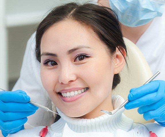 Woman smiling after root canal therapy