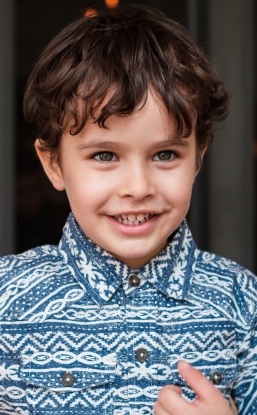 Young boy smiling after children's dentistry